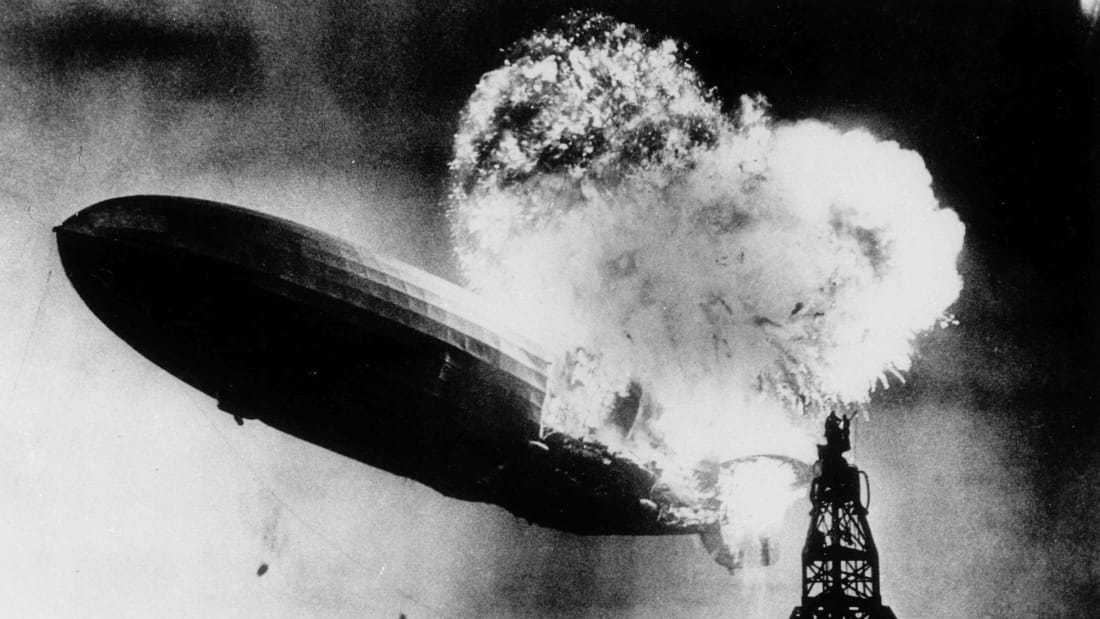 LZ-129 Hindenburg, a rigid airship manufactured in Germany by the Zeppelin Company, catches fire as it comes in for a landing in Lakehurst, New Jersey, on May 6, 1937. 