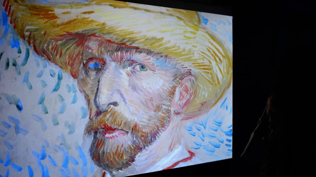 A self-portrait of Vincent Van Gogh is displayed on a screen in Rome in 2016