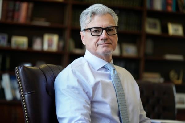 Judge Juan M. Merchan poses in his chambers in New York, March 14, 2024. (AP Photo/Seth Wenig, File)