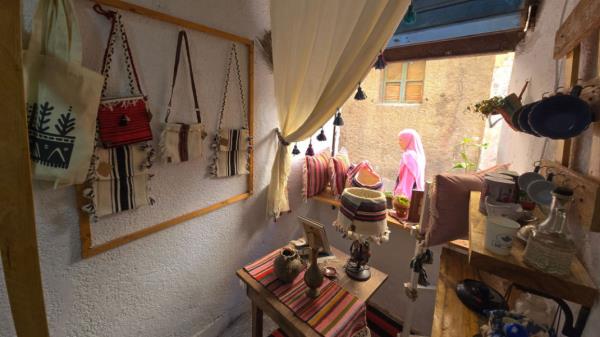 A woman walks in front of a shop selling traditio<em></em>nal items in the Old City of Tripoli on September 11, 2024. [Getty]