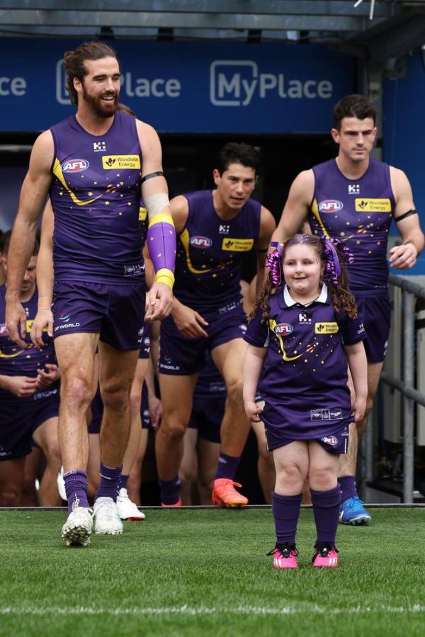 Pearce leads the Dockers out o<em></em>nto the field.